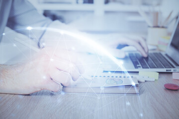 Fototapeta premium Social network theme hologram with businessman working on computer on background. Concept of world wide web. Multi exposure.