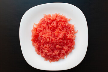 Red grapefruit fiber close-up. Fresh juicy cutted grapefruit without seeds and section shell