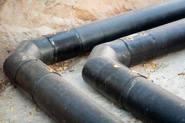 Replacement of the pipeline for the supply of hot water and heating to multi-storey buildings. There are two pipe lines in the trench. In the frame, the track is rotated by 90 degrees.