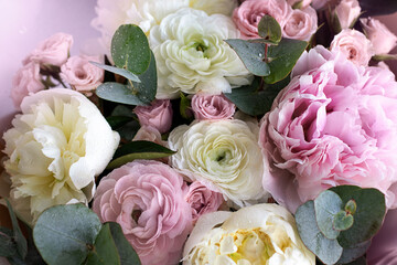 A beautiful bouquet of mixed flowers. The concept of a flower shop, flower Delivery. Close-up of a bouquet of peonies and roses