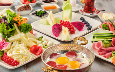 Delicious traditional turkish breakfast on wooden table