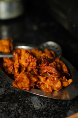Crispy kanda pakora or kanda bhaji. Mumbai's road side snack. Favourite monsoon snack in India.