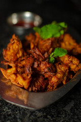 Crispy kanda pakora or kanda bhaji. Mumbai's road side snack. Favourite monsoon snack in India.