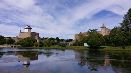 Landscape: backwater and two fortresses opposite each other on a clear sunny day.