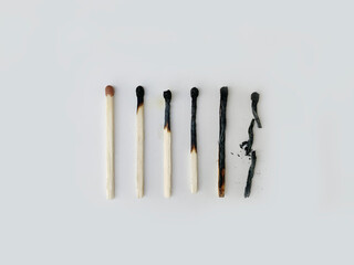 One unburned match in row of burned ones.