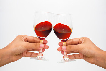 Close-up of wine clinking glasses