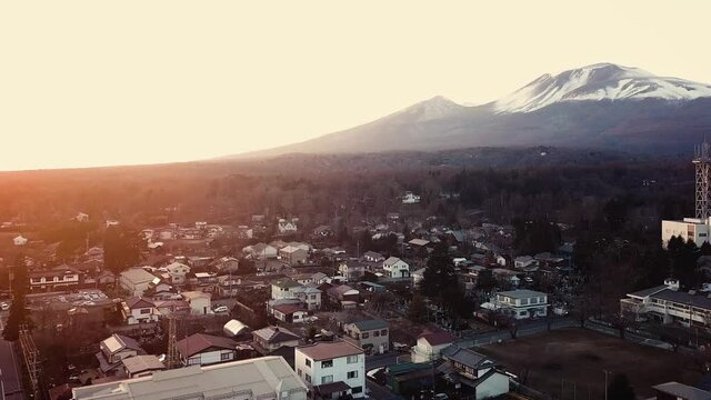 Aerial sunrise of Mount Myoko & City during winter, Niigata , Japan