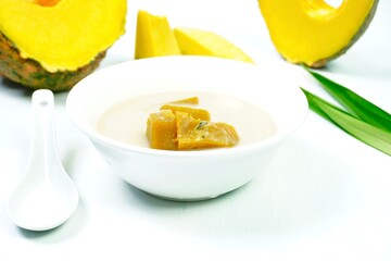 Fototapeta na wymiar Pumpkin dessert with coconut milk Thai food