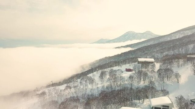 Aerial view of cloud covering snow mountain in Myoko, Niigata, Japan