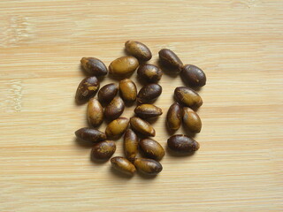 Brown and yellow color raw dried seeds of Soursop fruit or Annona muricata