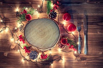 Wooden stump with happy new year decoration. Round cut down tree with annual rings as a wood...