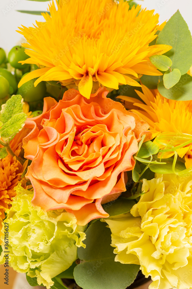 Wall mural Bouquet of yellow and orange color flowers