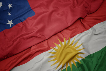 waving colorful flag of kurdistan and national flag of Samoa .