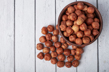 Walnut kernels on a wooden background.Almonds, walnuts and hazelnuts in bowls on a wooden background