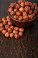 Walnut kernels on a wooden background.Almonds, walnuts and hazelnuts in bowls on a wooden background