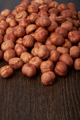 Walnut kernels on a wooden background.Almonds, walnuts and hazelnuts in bowls on a wooden background