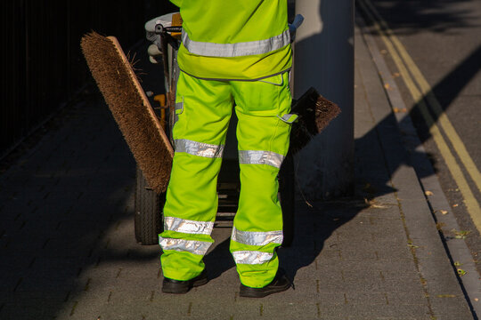 A road sweeper in high visibility clothing 