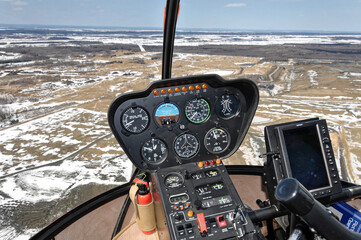 Cockpit of a helicopter in flight overhead east of Montreal