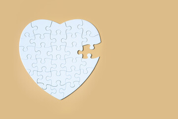 Unfinished white jigsaw puzzle pieces on Yellow background, The last piece of jigsaw puzzle, Copy...