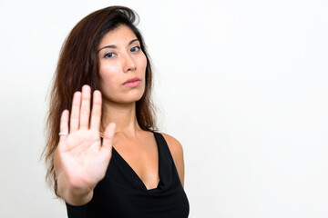 Fototapeta premium Portrait of young beautiful woman showing stop gesture