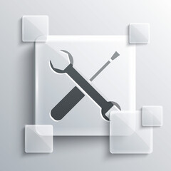 Grey Screwdriver and wrench spanner tools icon isolated on grey background. Service tool symbol. Square glass panels. Vector Illustration.