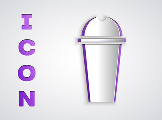 Paper cut Milkshake icon isolated on grey background. Plastic cup with lid and straw. Paper art style. Vector Illustration.