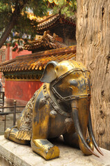 Bronze statue depiction of an elephant in a public park in China