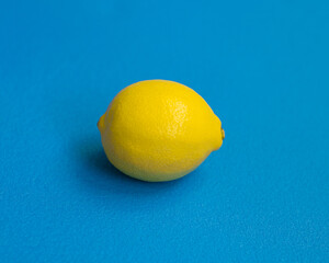 The lemon on blue background.