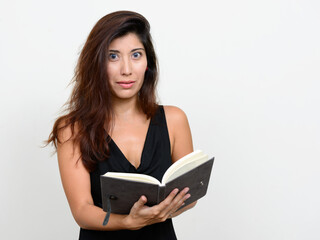 Portrait of young beautiful woman reading book