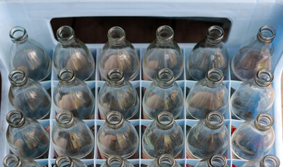 
Glass bottle inside the container Waiting for the glass recycling process