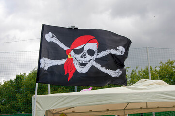 Pirates skull and crossed bones flag flying.