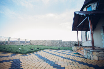 Stone pavement in perspective. Stone pavement texture. Granite cobblestoned pavement background. Abstract background of a cobblestone pavement