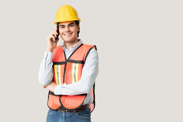 Confident Engineer Listening To Call On Mobile Phone