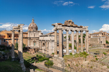 Naklejka premium Panorama of roman forum the heart of roman empire. From the Campidoglio they can be seen the Arch of Severus, the temples Saturn and Vesta, Basilica of Maxentius, Arch of Titus, Colosseum Rome, Italy.