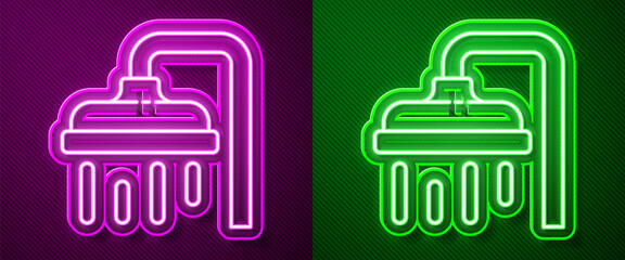 Glowing neon line Shower head with water drops flowing icon isolated on purple and green background. Vector Illustration.