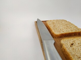 
slices of lactal bread cut by knife with a white background