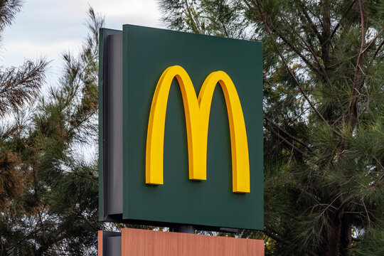 Coina, Portugal - October 23, 2019: The Golden Arches, the symbol or logo of McDonald’s on top of a signboard at the entrance of the McDonalds restaurant
