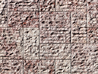 New stone wall background with rough irregular texture bricks or tiles