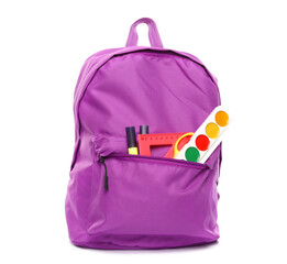 School backpack and stationery isolated on white background