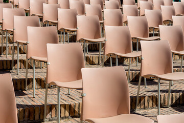ordered chairs pattern for outdoor event with security measures