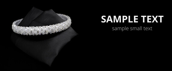 Jewellery white gemstone diamonds hair band tiara on black background. Wide mockup postcard for copy space © axivan.com