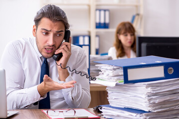 Two employees working in the office