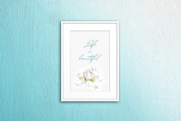 Frame with floral poster isolated on light green painted wall