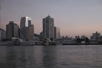 Fototapeta premium city at the river sunset 
