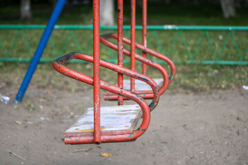 Very old swing for children. Old playground.
