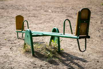 Very old swing for children. Old playground.