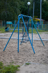 Very old swing for children. Old playground.