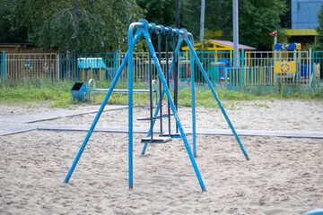 Very old swing for children. Old playground.