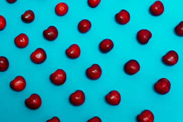 delicious fresh cherries on blue background