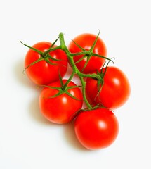 Fresh tomatoes on a white background.
